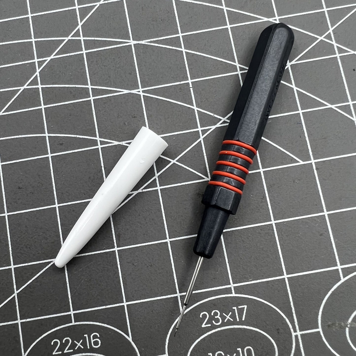 Swiss Bergeon 7013-R red metal dip oiler for precise watch grease application, ergonomic design for watchmakers.