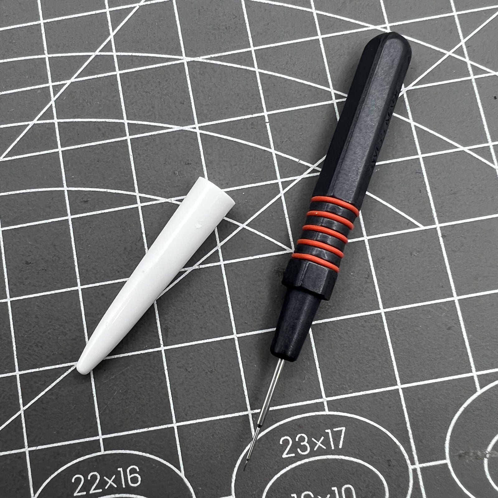 Swiss Bergeon 7013-R red metal dip oiler for precise watch grease application, ergonomic design for watchmakers.