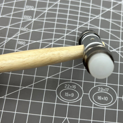 Swiss Bergeon 30417 hammer with brass and synthetic ends for precise watch accessory repairs.