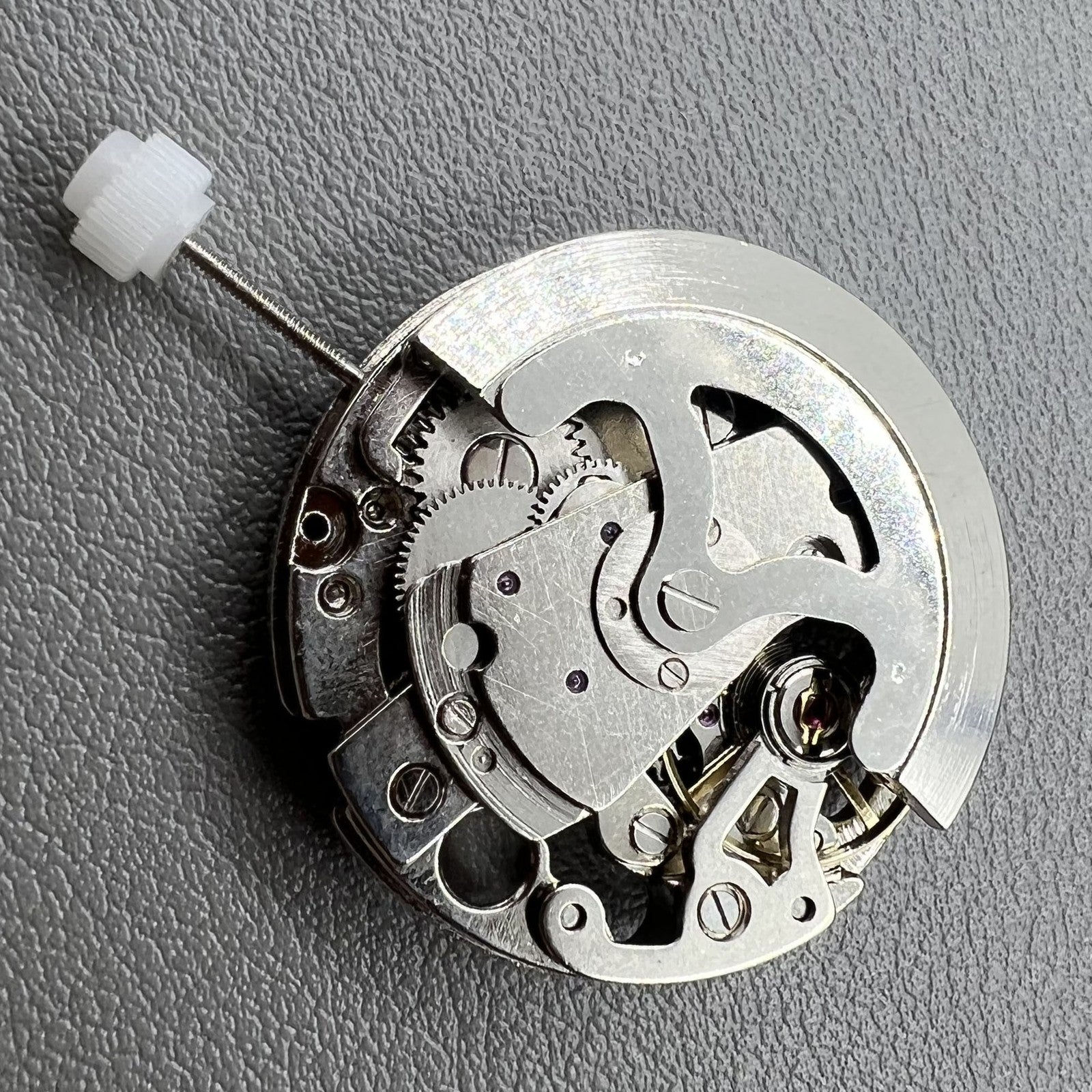 7120 Hollow silver automatic watch movement showcasing intricate mechanical gears and craftsmanship.