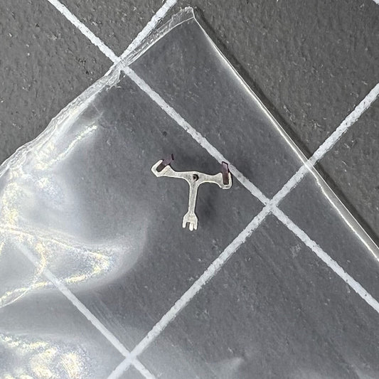 Pallet fork for Dandong 7750 watch movement, precision replacement part for reliable timekeeping.
