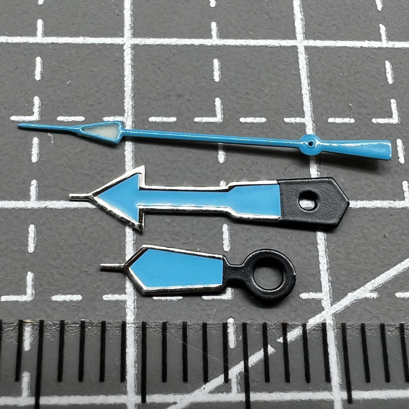 Seiko NH35 NH36 watch movement with blue hands, green luminescence, and polished dark silver edges