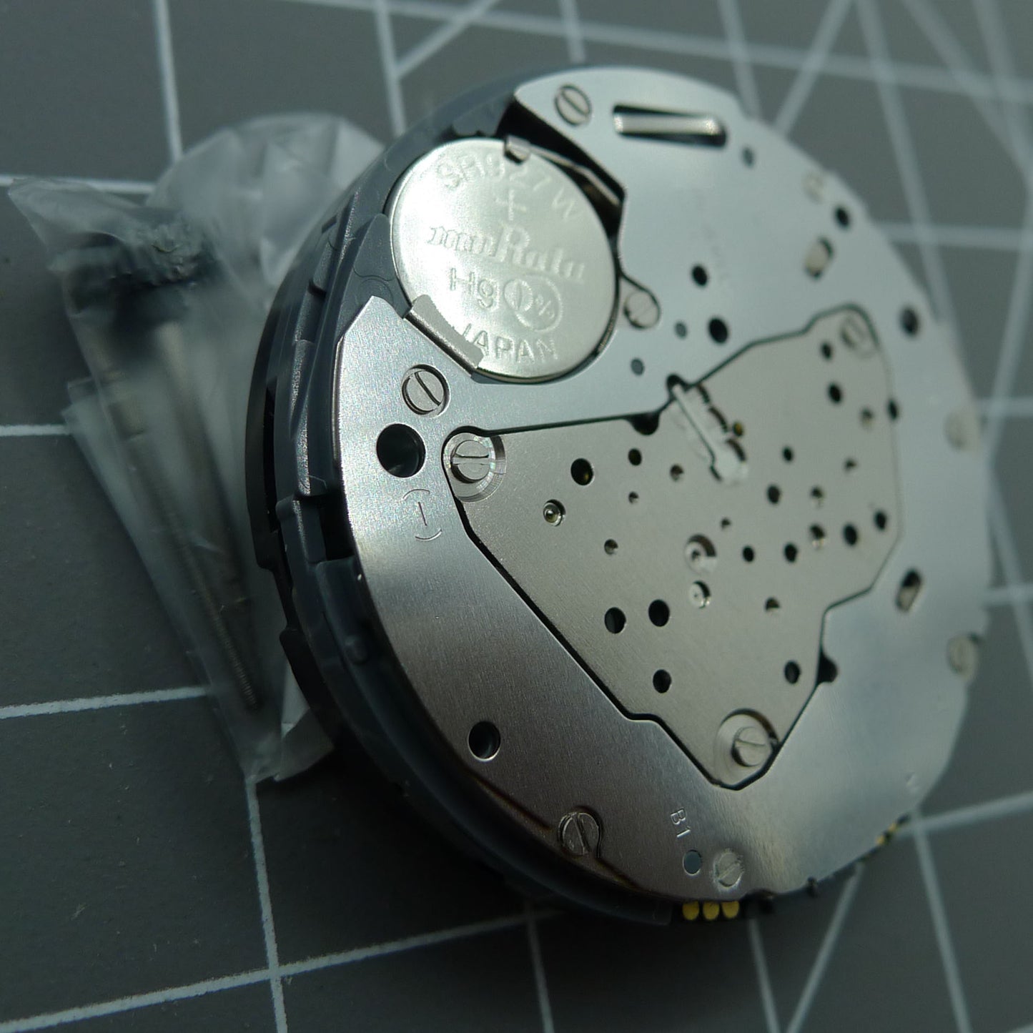 Miyota 6S50 quartz watch movement with date at 12 and small seconds at 3, 6, and 9 positions for precise timekeeping.