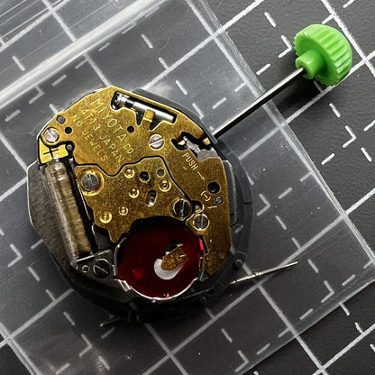 Miyota 4T13 quartz watch movement with three hands and date display at 3 o'clock slot.