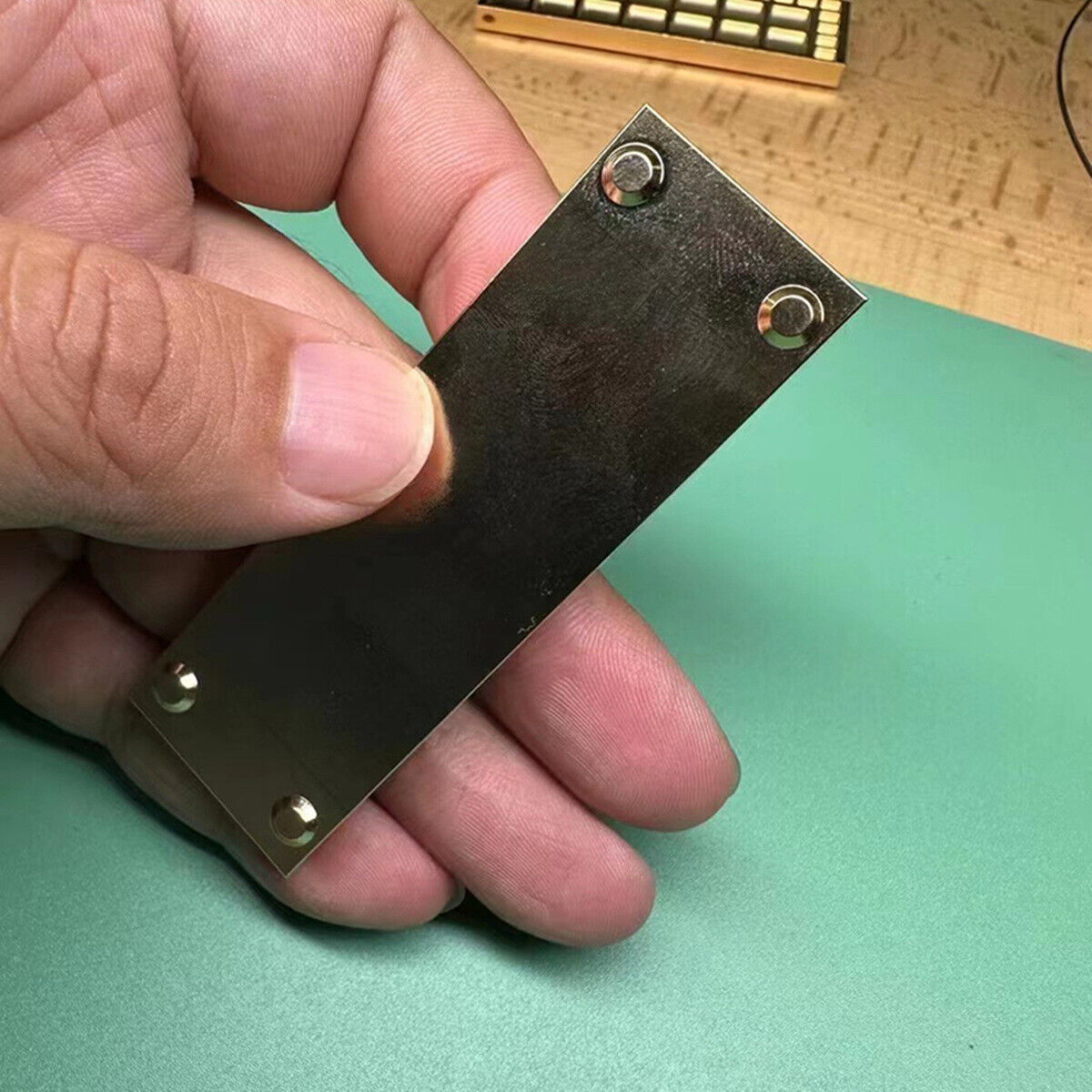 Square copper golden storage tray with 33 grids by Suqare, ideal for organizing screws in watch repair kits.