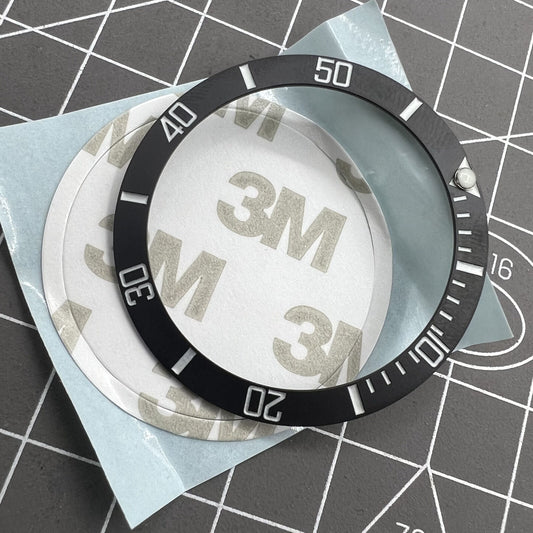 38mm ceramic watch bezel with black slope, silver font, and blue luminous details for watch accessories.