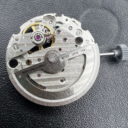 Miyota 82S0 silver hollow automatic mechanical movement, precise watch accessory for repair and customization.
