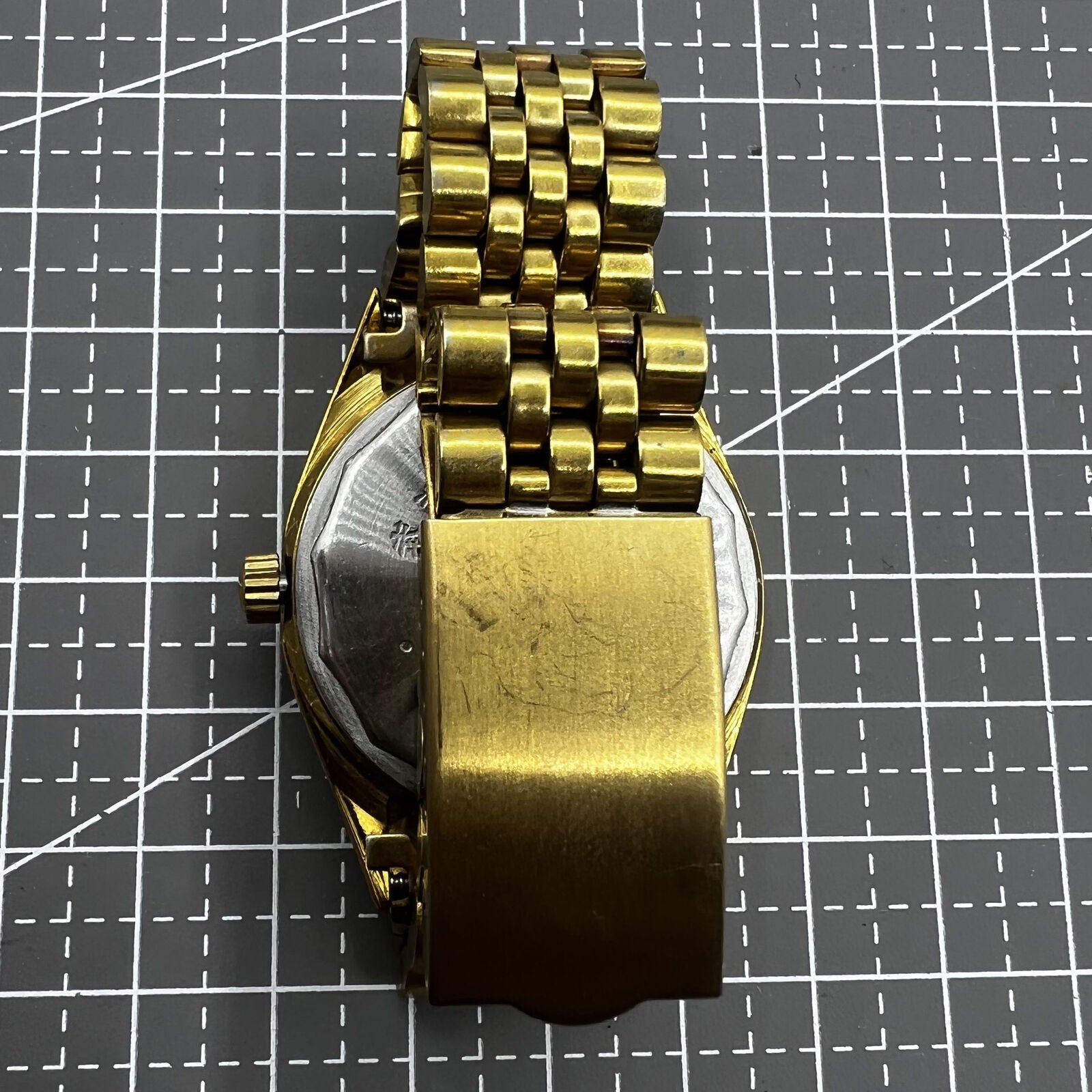 38mm Wudang Steel mechanical watch with golden dial, single calendar, 17 jewels, classic luxury accessory.