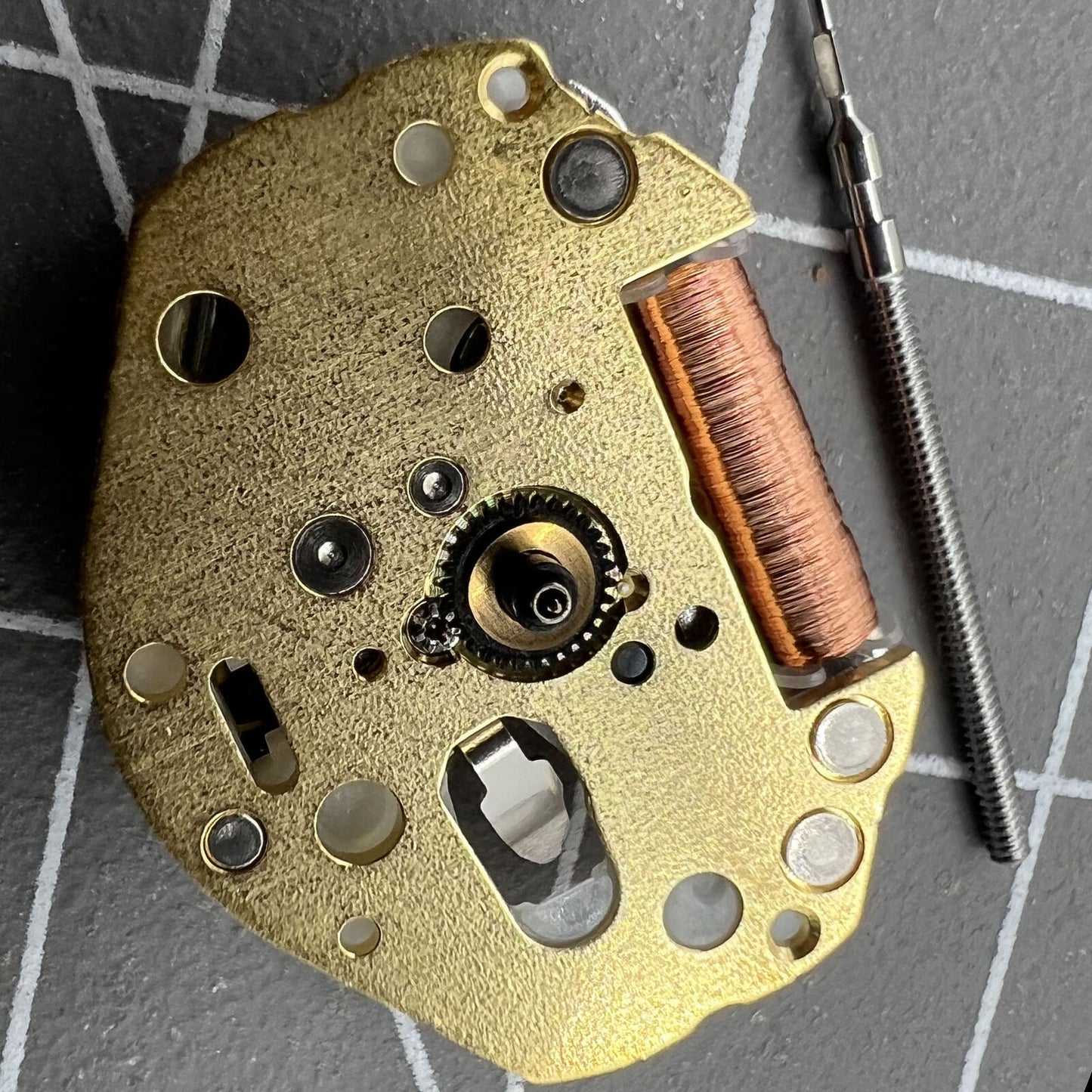Miyota SUPER 2035 quartz watch movement close-up, precision engineering by Japan Made brand.