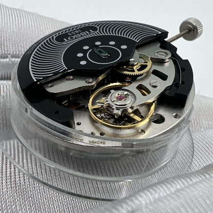 Swiss Made ETA C01.211 chronograph watch movement with black dial, mechanical precision by Tissot 1853.