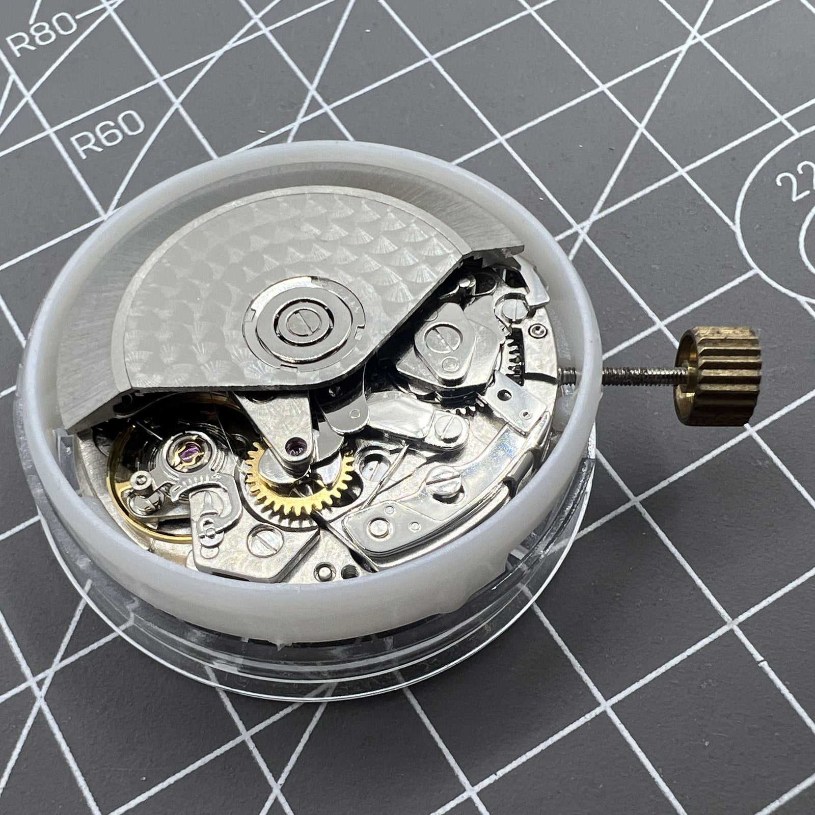 China Made 7750 Automatic Chronograph Movement by ETA displaying detailed gears at 3, 6, and 9 o'clock positions.