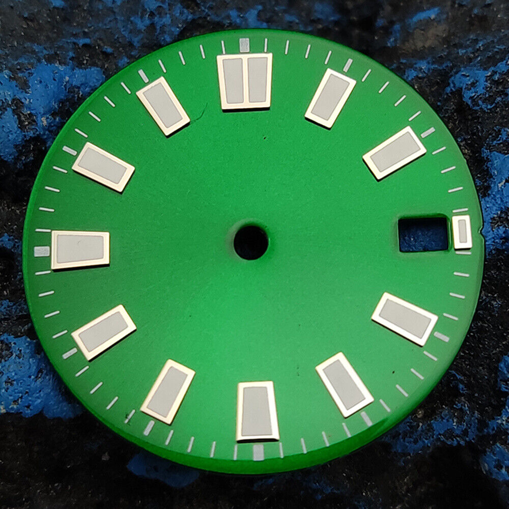 Green luminous watch dial with silver and golden nail trim, compatible with NH35 movement, for elegant timepieces.