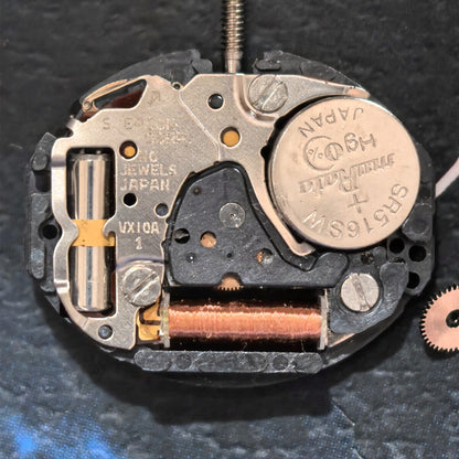 TMI VX10A quartz watch movement with 2 hands, Japan made, for precise watch repairs and replacements.