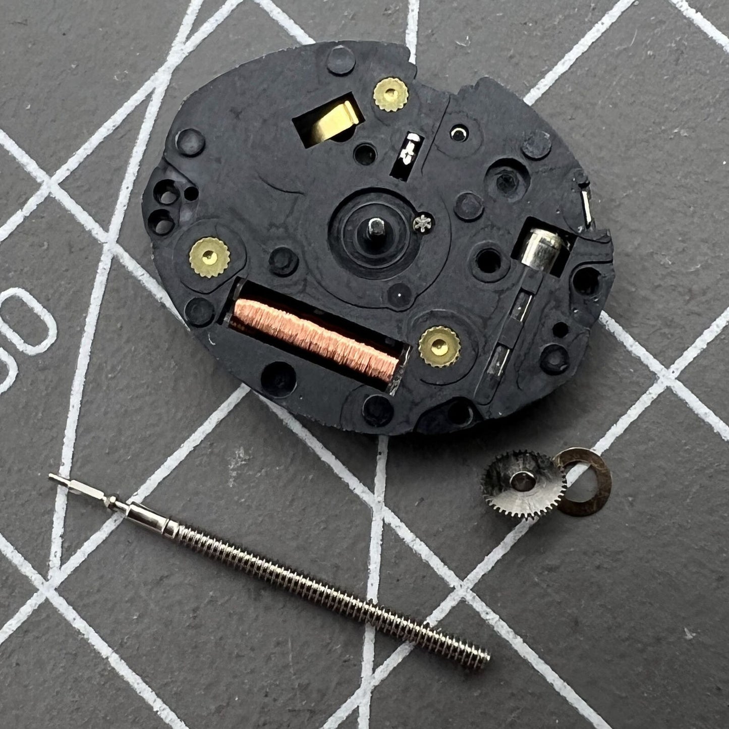 Epson TMI VX10A quartz watch movement with 2 hands, precise timekeeping for watch repair.