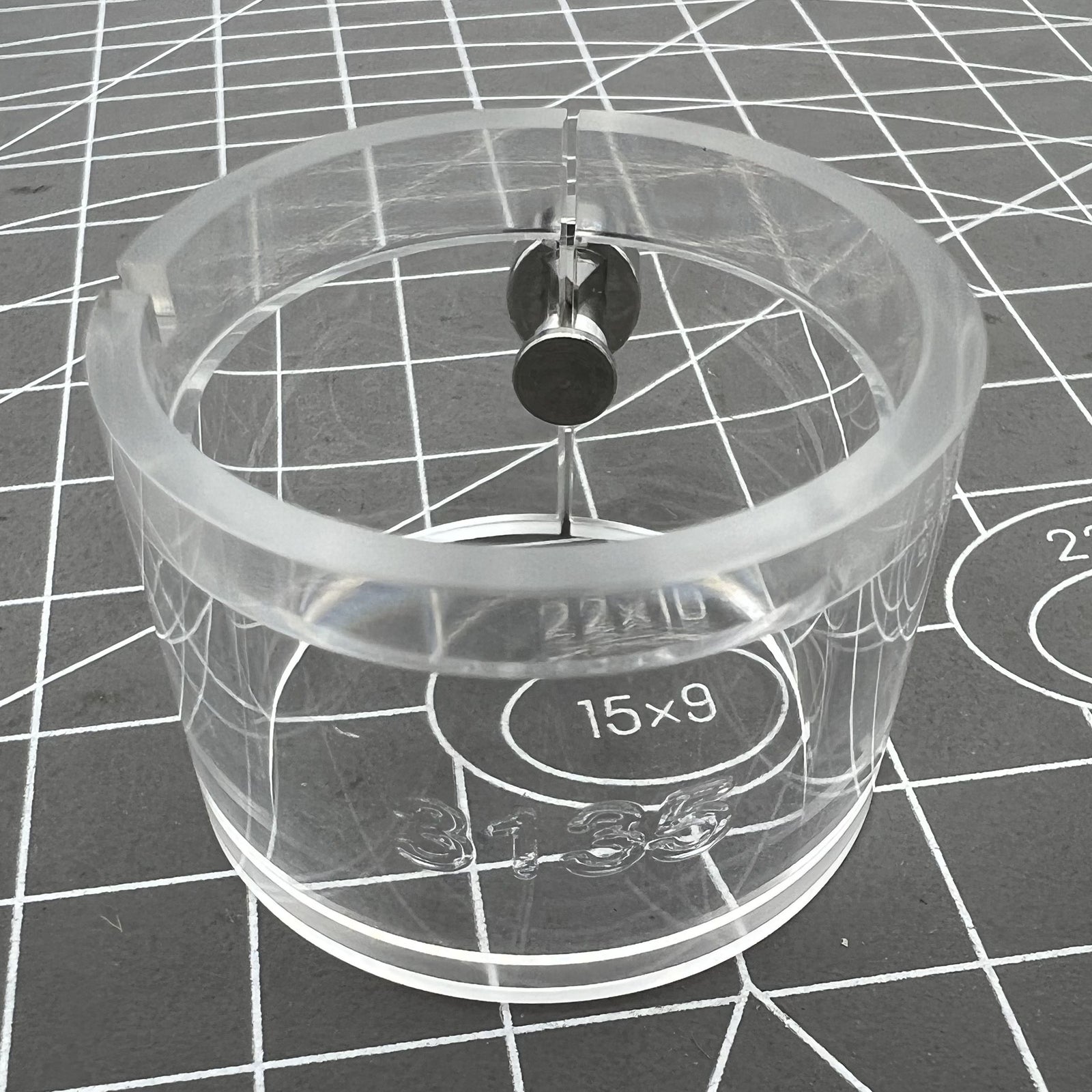 Transparent watch movement holder for RLX3135, secure and precise accessory.
