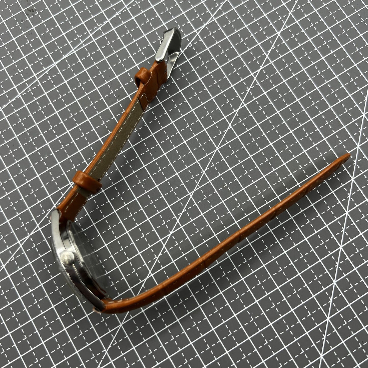 PUBU 32mm manual mechanical watch with grey dial, nail markers, and 17-jewel movement for precision timekeeping.