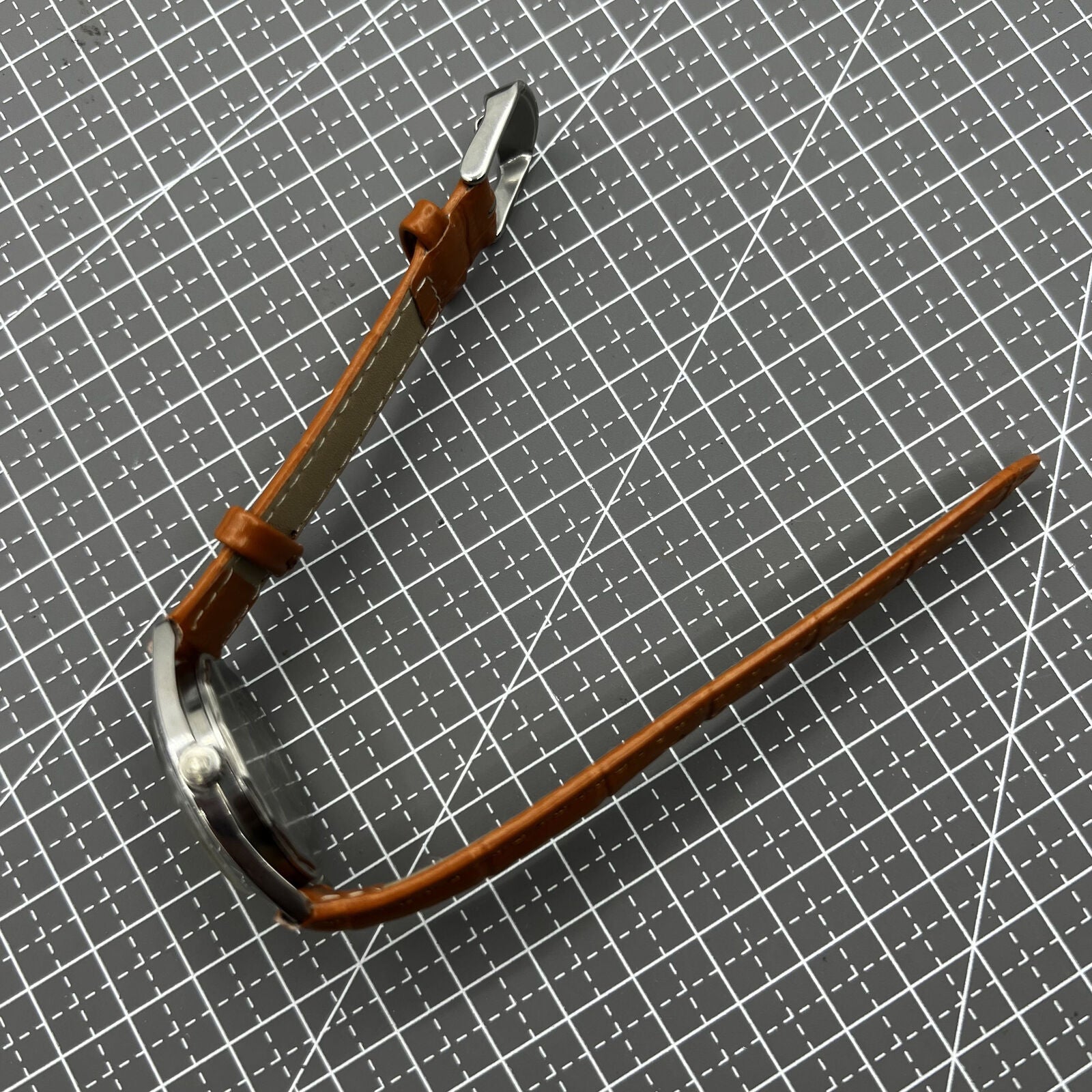 PUBU 32mm manual mechanical watch with grey dial, nail markers, and 17-jewel movement for precision timekeeping.