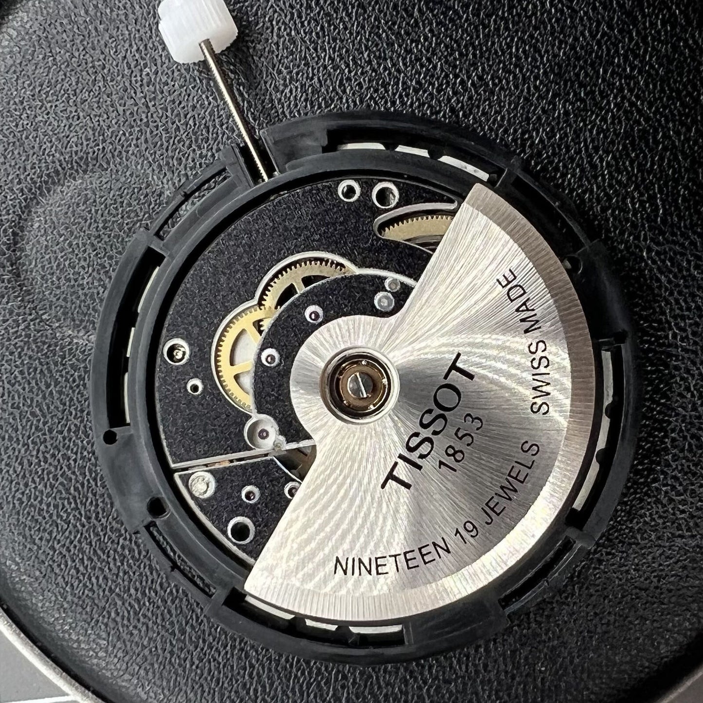 Tissot Swiss Made ETA C15.111 chronograph watch movement with white dial for accurate timing.