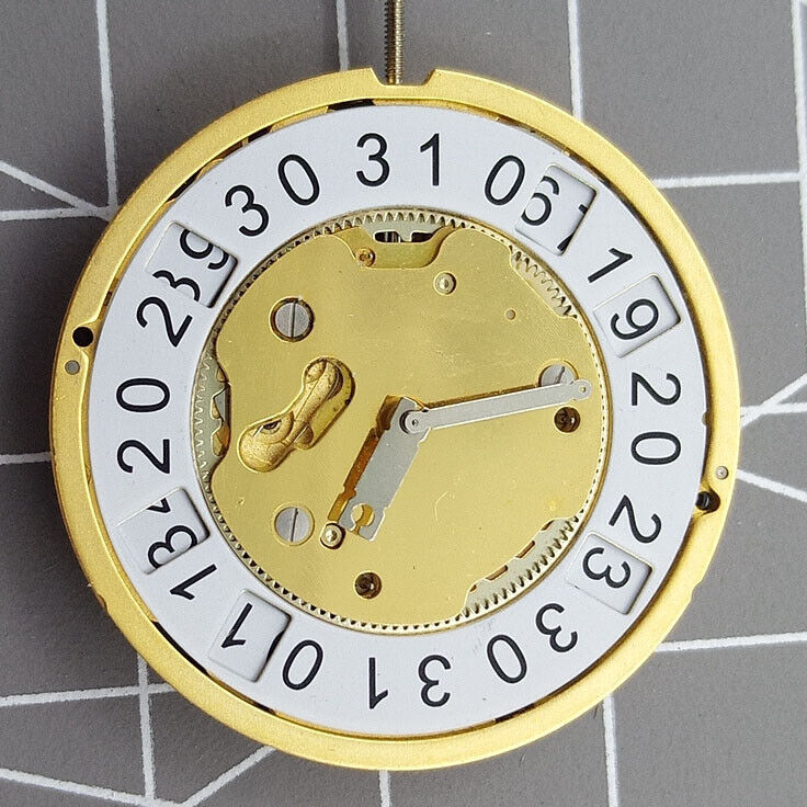 Golden Swiss Made Ronda 5040B quartz watch movement for precise timekeeping in luxury accessories.