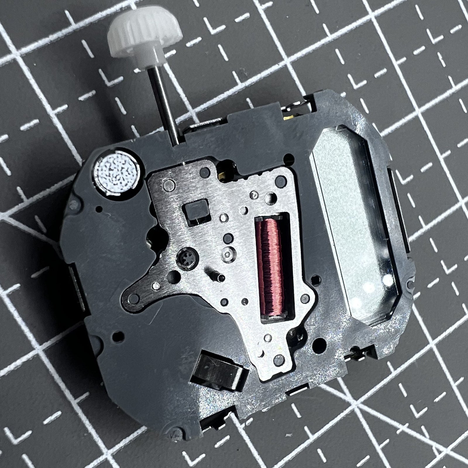 Japan Miyota T480 quartz movement watch mechanism with 3 hands and display screen for precise timekeeping.