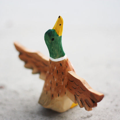 Handmade Flying Mallard wooden figurine, charming decor for watch accessory displays.
