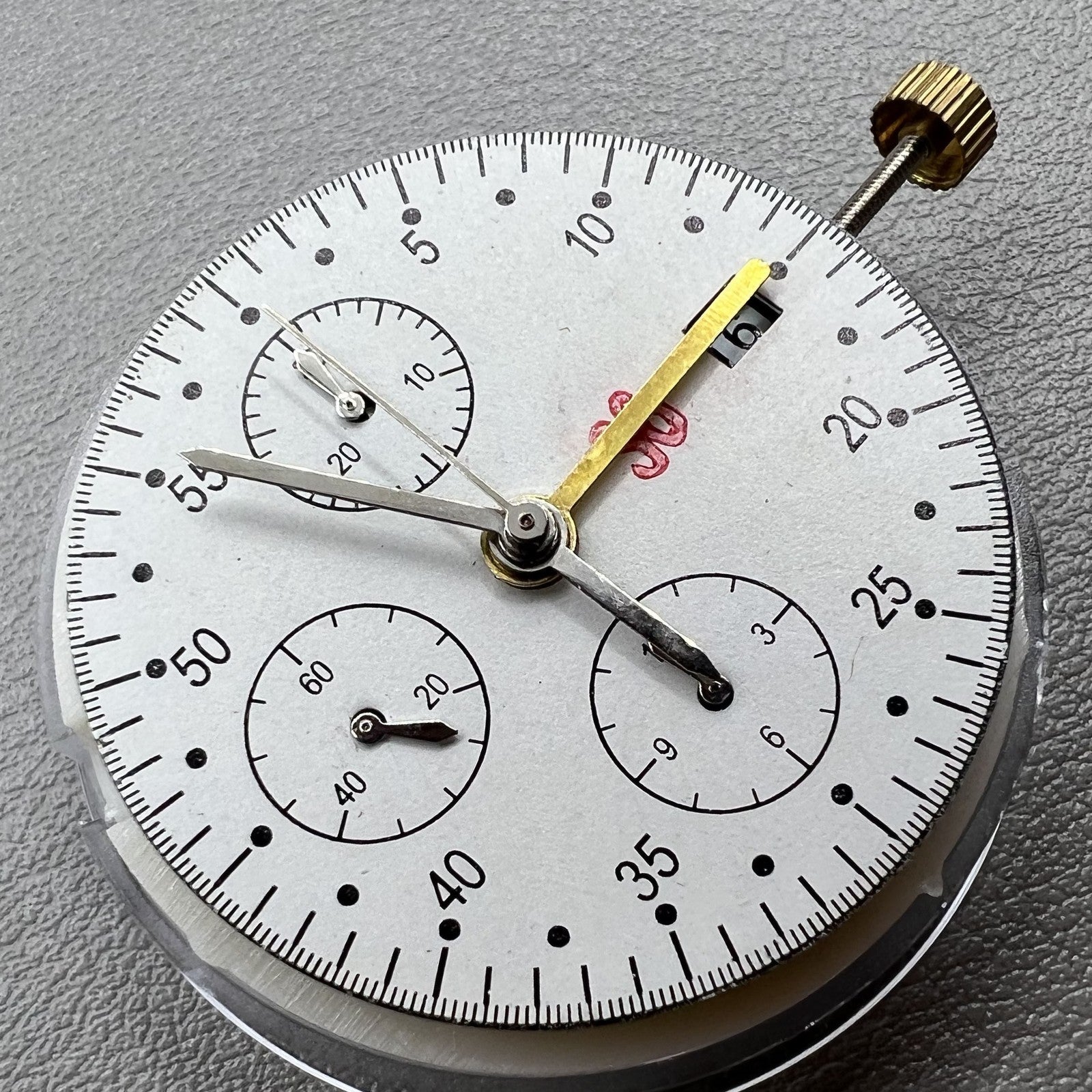 Dandong 7750 mechanical watch movement showing single calendar and small second subdials at 6, 9, and 12 o'clock
