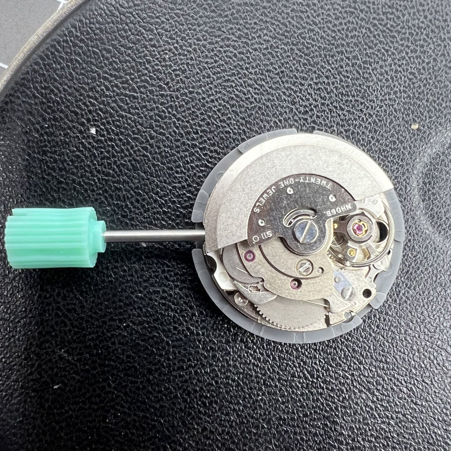 NH06A watch movement displaying double calendar date window at 3 o'clock, precision Japan-made mechanism by Seiko.