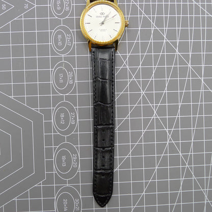 Beijing Double Rhomb watch with golden case and silver nail markers, manual mechanical movement for timeless elegance.