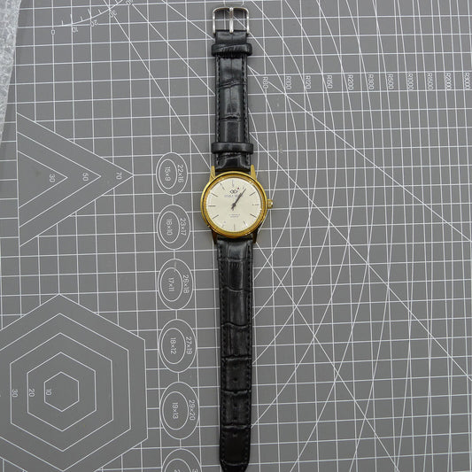 Beijing Double Rhomb mechanical watch with golden case and silver hour markers, elegant design.