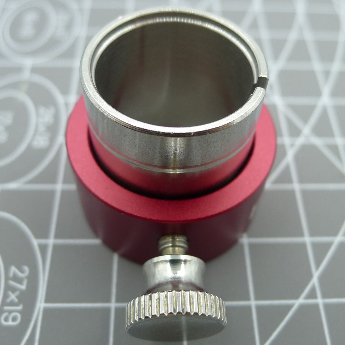 Reversible movement holder with knob by ETA, designed for securing ETA 2000 watch movements during repairs.
