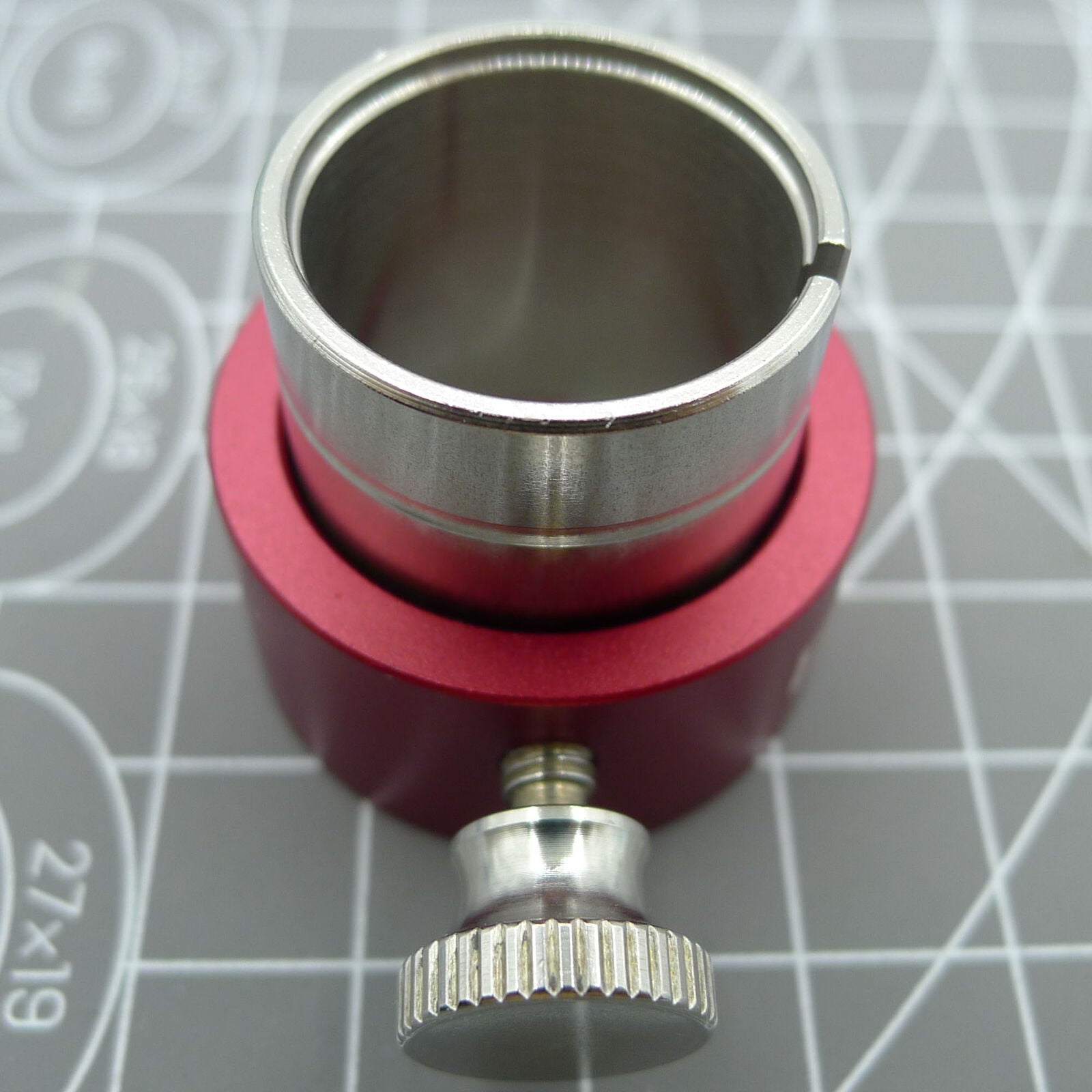 Reversible movement holder with knob by ETA, designed for securing ETA 2000 watch movements during repairs.
