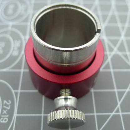 Reversible movement holder with knob by ETA, designed for securing ETA 2000 watch movements during repairs.