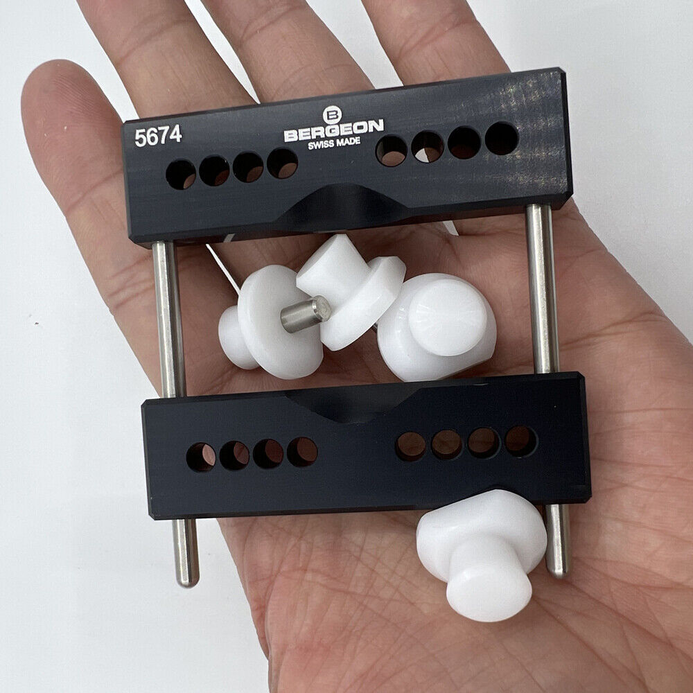 Bergeon 5674 vise jaws holder securely holding watch case for precise repair with 5700-Z tool