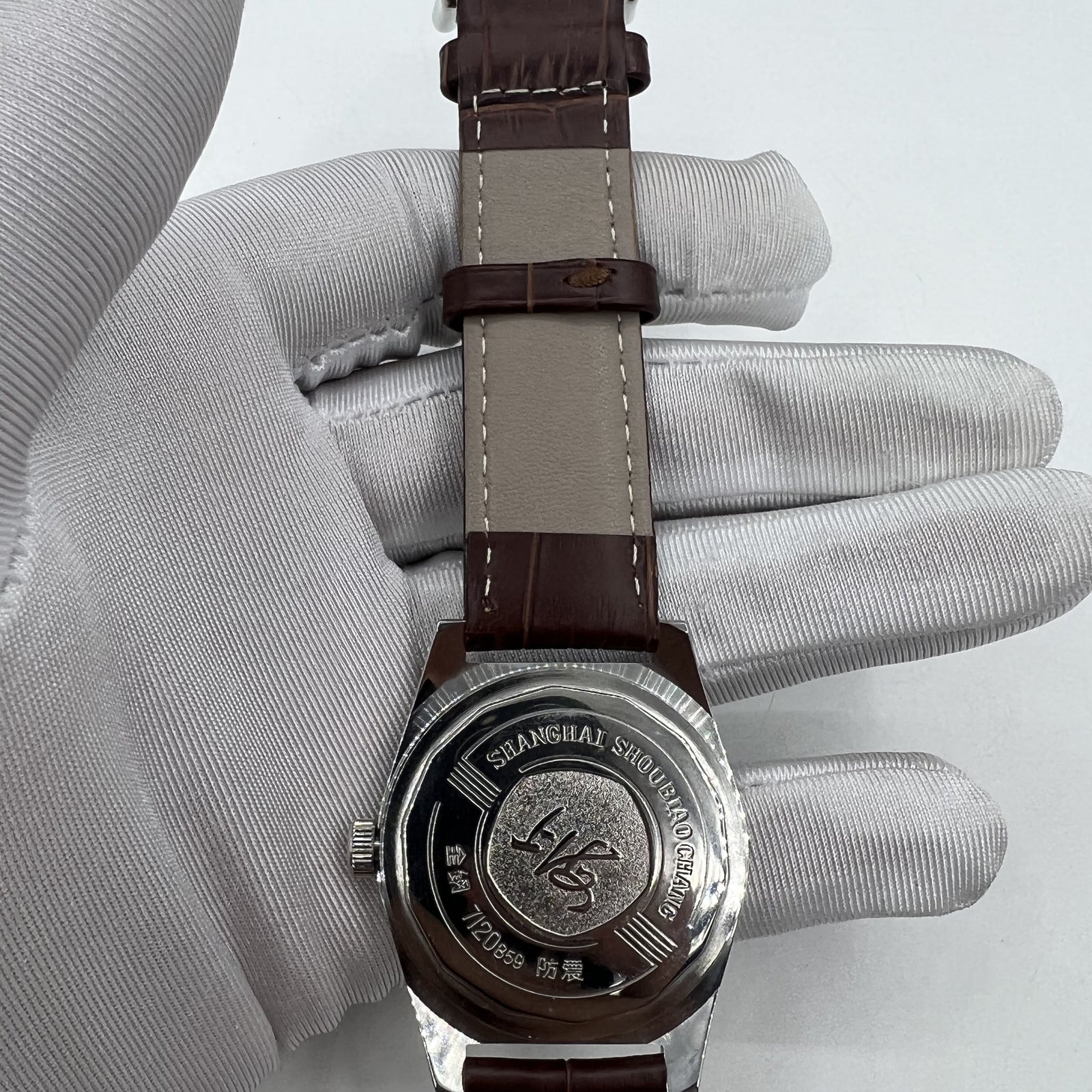 Shanghai Factory 38mm manual mechanical watch with white dial, 3 hands, and 19 jewels for precise timekeeping.