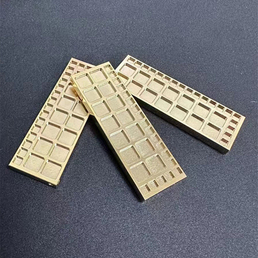 Square copper golden storage tray with 33 grids by Suqare, ideal for organizing screws in watch repair kits.