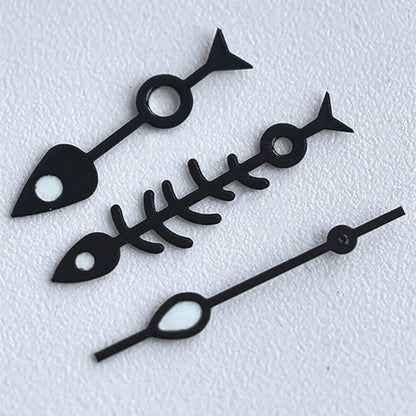 Matted black fish bone watch hands with white trim and green lume, designed for NH35 NH36 movements.