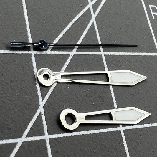 Silver watch hands with dark blue trim and green lume, Ronda 515 quartz compatible for accurate timing.