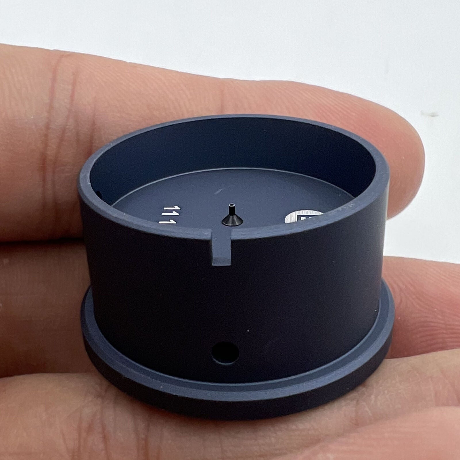 Bergeon 7100-11 1/2 watch movement holder gripping parts for precise watch repair and maintenance.