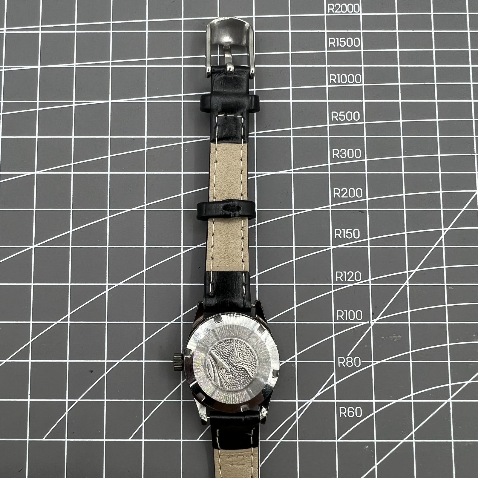 Seagull black case ladies manual watch with gold nail markers, shock-resistant for everyday durability.