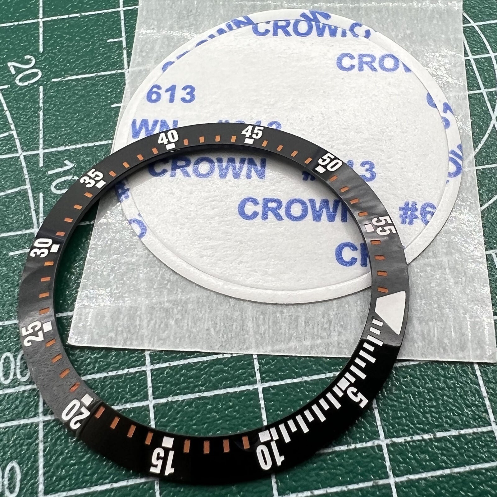 Wholesale black ceramic watch bezel insert with orange graduation, 38mm/30.5mm, ideal for watch repairs and customization.