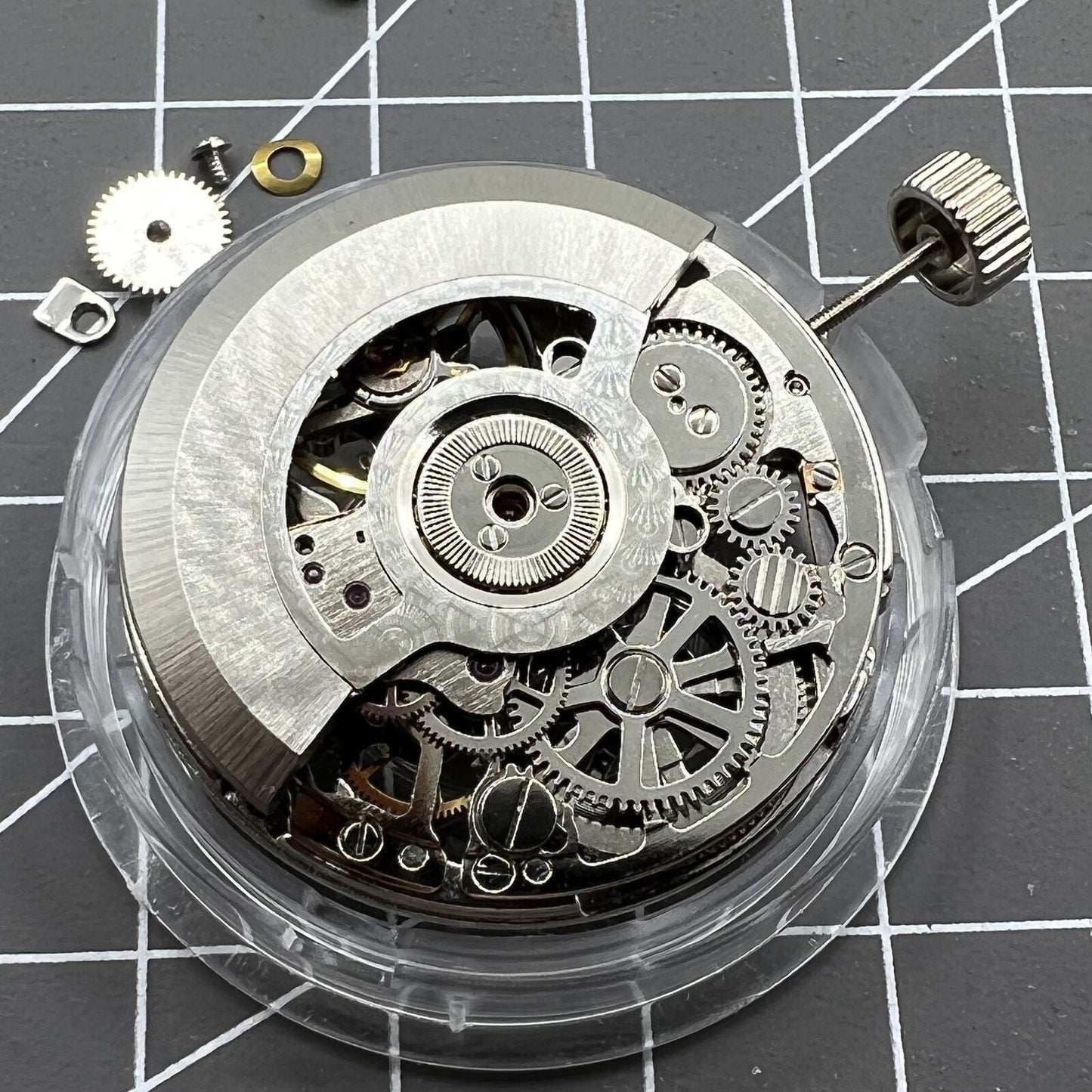 Tianjin Seagull ST25 silver automatic watch movement displaying hollow 3-hand mechanical design.