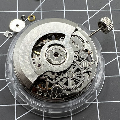 Tianjin Seagull ST25 silver automatic watch movement displaying hollow 3-hand mechanical design.