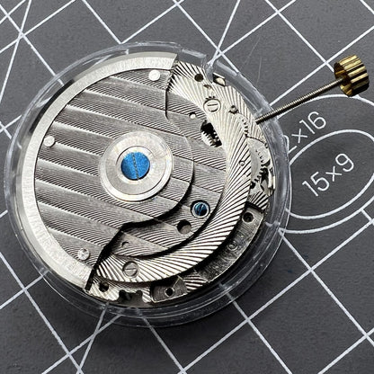 Automatic mechanical watch featuring reversed balance wheel and big date at 12 for precise timekeeping.