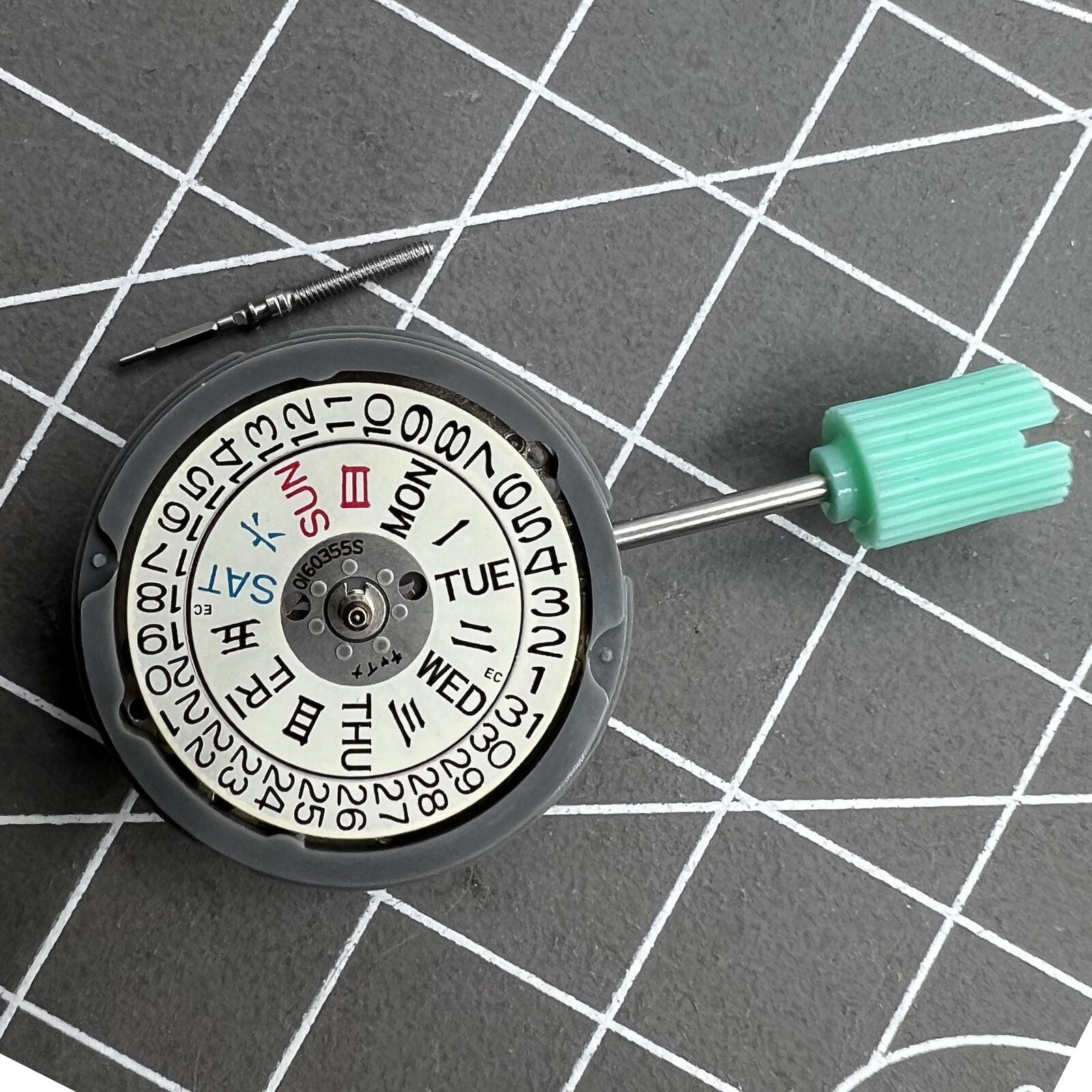 NH06A watch movement showcasing double calendar date at 3 o'clock, precision Japan-made mechanism.