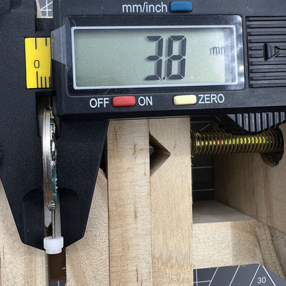 Swiss ETA 955.114 quartz watch movement with single calendar date at 3 o'clock, precise timekeeping component.