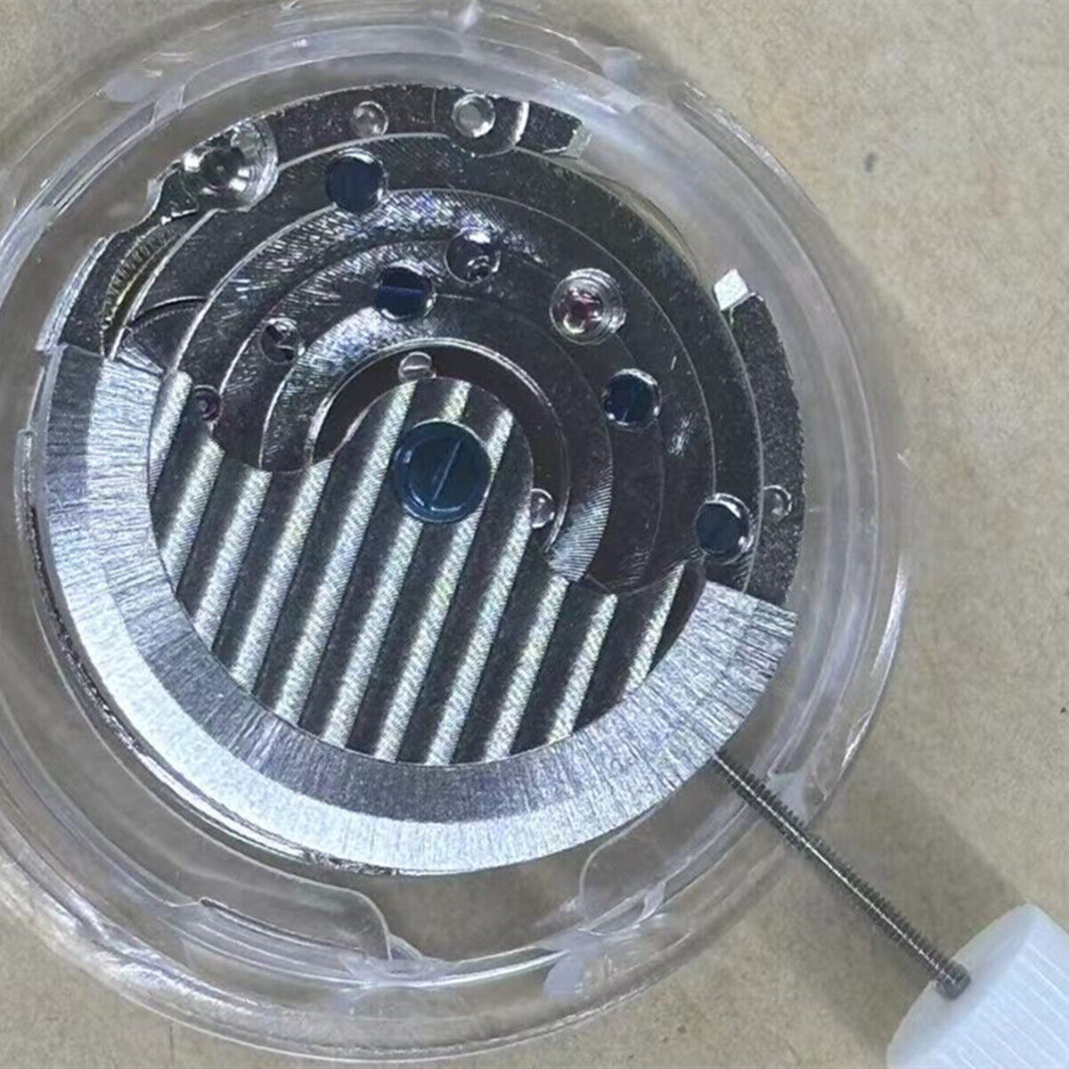 China Made Lady watch with automatic movement and visible balance wheel at 6 o'clock, elegant design.