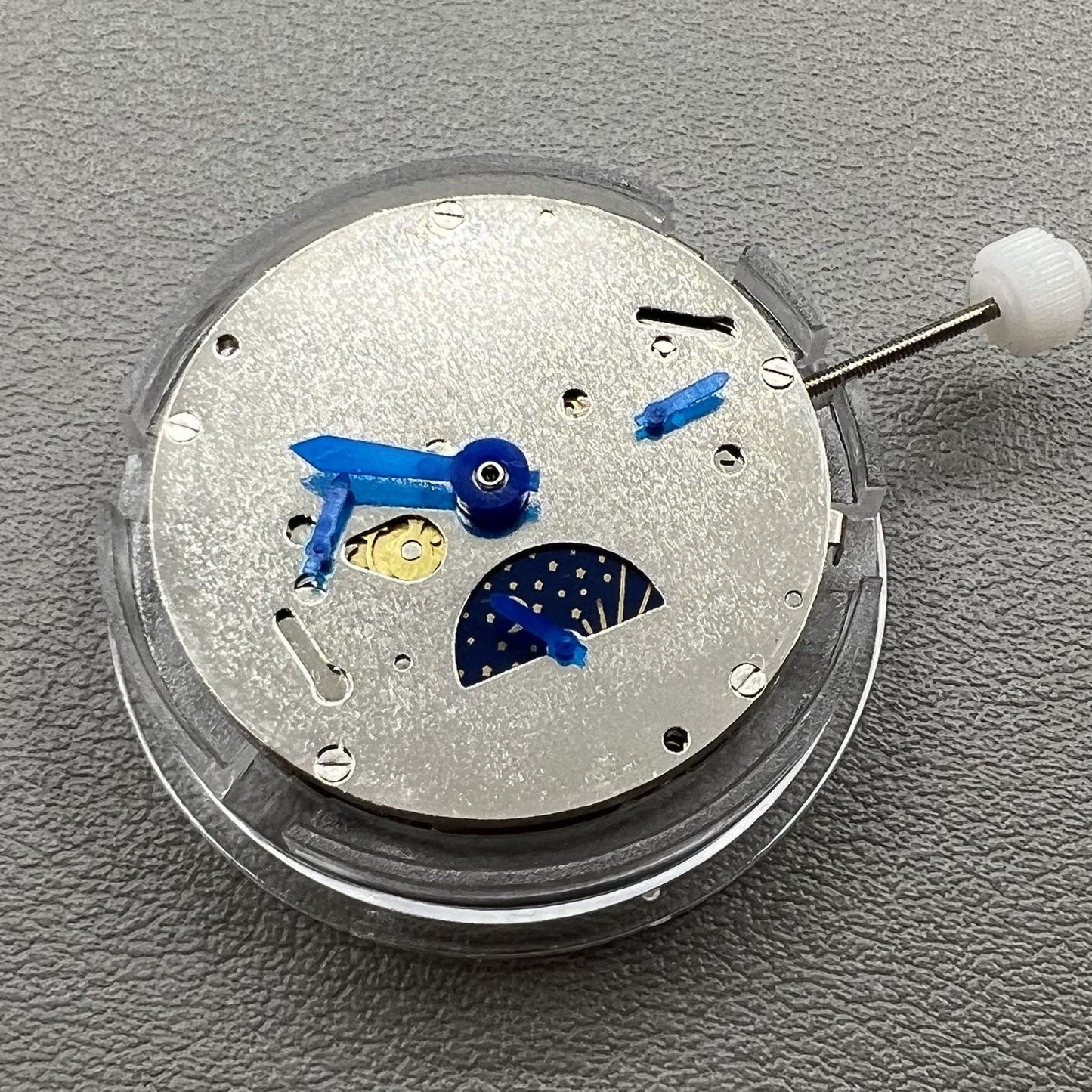 China Made 8205 automatic mechanical watch movement with small seconds at 3, 6, and 9 o'clock positions.
