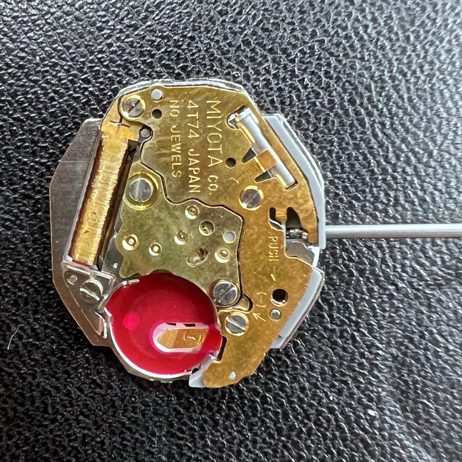 Miyota Japan 4T74 quartz movement with single hand and date at 6 o?clock, ideal for precise watch repairs.