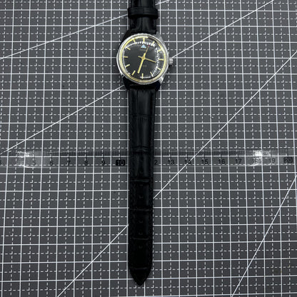 Taihang 32mm manual watch with black strap, gold markers, and black dial for classic elegance.