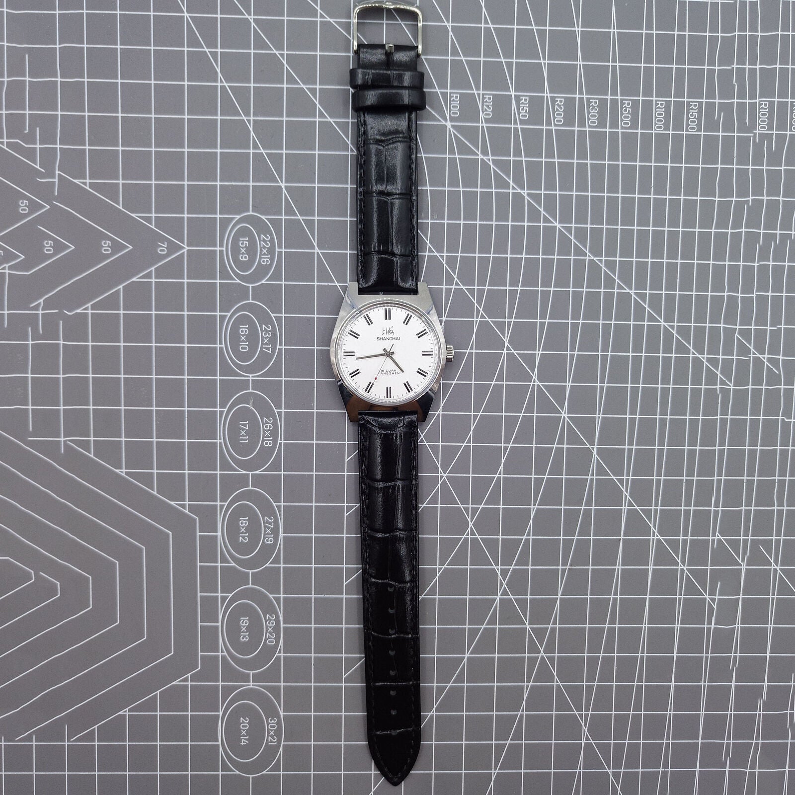 Shanghai Factory 38mm manual mechanical watch with white dial, 3 hands, 19 jewels, classic design.